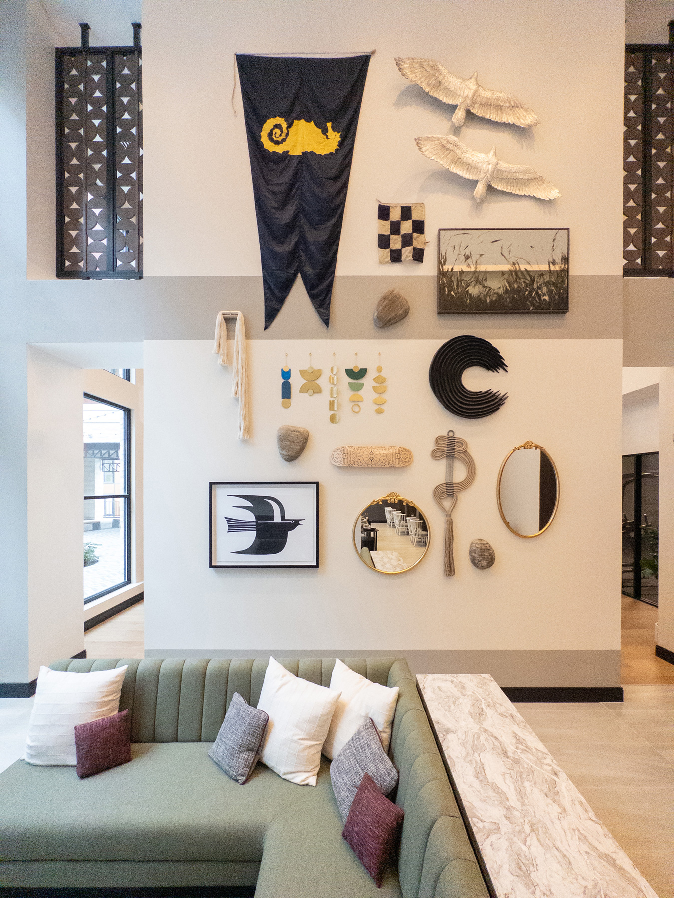 Curated objects above a sofa in a Bergmeyer interior